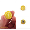 Pin's en forme de rondelle de citron jaune