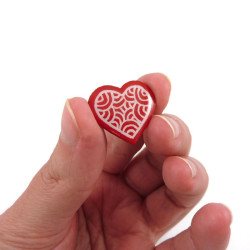 Red heart with white doodles pin badge