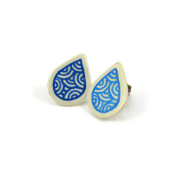 White droplets ear studs with metallic blue doodles