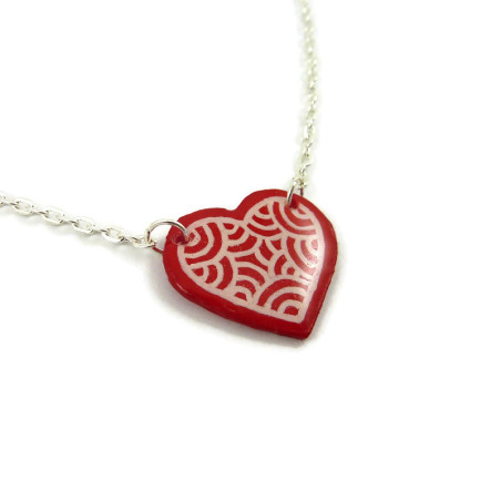Red heart necklace with white doodles Red heart necklace with white doodles