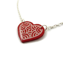 Red heart necklace with white doodles