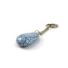 Small painted pebble keychain with metallic blue and white doodles