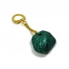 Painted rock keychain with metallic emerald green and black doodles