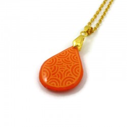 Orange teardrop necklace with pastel orange doodles