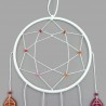White dreamcatcher with leaves in the colors of the lesbian flag