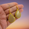 Yellow raindrops dangle earrings with purple doodles