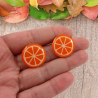 Puces d'oreilles en forme de rondelles d'oranges réalisées en CD recyclé et peintes à la main par Savousépate
