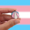 Hexagonal badge with the transgender pride colors (blue, pink and white)
