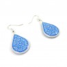 White drops earrings with metallic royal blue doodles