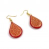 Red raindrops dangle earrings with yellow doodles