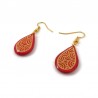 Red droplets dangle earrings with yellow doodles