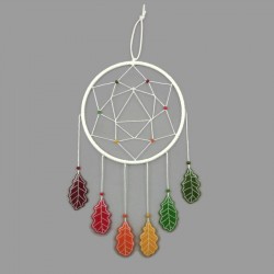 White dreamcatcher with autumn oak leaves