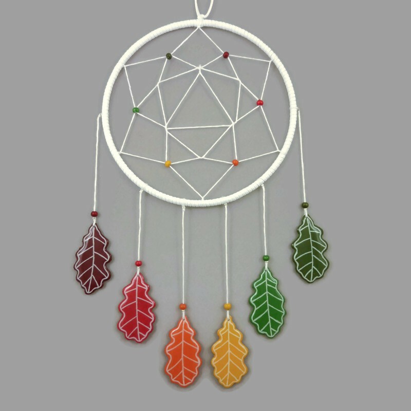 White dreamcatcher with autumn oak leaves
