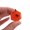 Hexagonal charm representing a mosquito trapped in amber