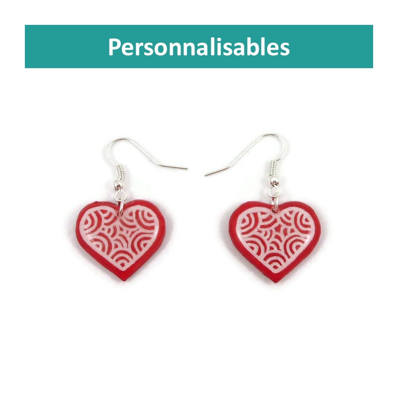 Customizable hearts dangle earrings with white doodles