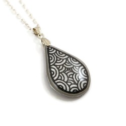 Silver teardrop necklace with black doodles