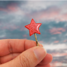 Eco-friendly hair pin in the form of red star with pink doodles