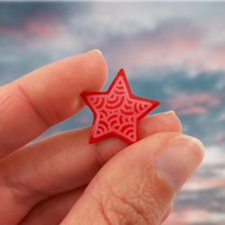 Eco-friendly pin badge in the form of red star with pink doodles