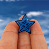 Eco-friendly pin badge in the form of dark blue star with sky blue doodles