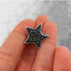 Eco-friendly pin badge in the form of silver star with black doodles
