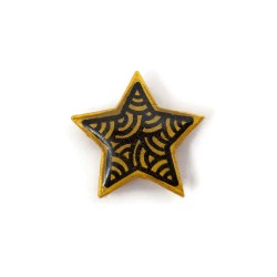 Eco-friendly magnet in the form of gold star with black doodles