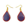 Red teardrops dangle earrings with blue doodles