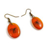Mosquito in amber ovals dangle earrings