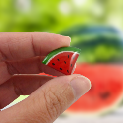 Eco-friendly triangular watermelon slice pin badge, made with hand-painted recycled CD