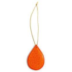 Orange drop suspension with light orange doodles