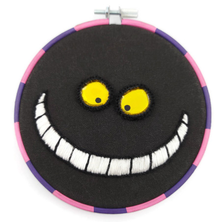 Broderie Chat du Cheshire, avec un sourire phosphorescent