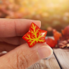 Red ivy leaf pin badge